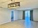 Spacious living room featuring neutral walls, tile flooring, and natural light at 7109 Kirsch Ct # 2, New Port Richey, FL 34653