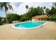 A beautiful pool and pool house surrounded by brick pavers for lounging at 7109 Kirsch Ct # 2, New Port Richey, FL 34653