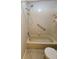 Bathroom featuring a shower and a grab bar for accessibility and a safe bathing experience at 7816 Hardwick Dr # 1013, New Port Richey, FL 34653