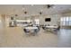 Spacious community room featuring kitchen, tables and chairs, and views to the exterior at 8150 Brent St # 713, Port Richey, FL 34668