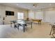 Game room featuring ping pong table, pool table, and comfortable seating at 8150 Brent St # 713, Port Richey, FL 34668