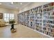 Cozy library featuring an extensive bookshelf and comfortable seating area at 8150 Brent St # 713, Port Richey, FL 34668