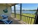 Enclosed patio seating area with views of the water and boat traffic on a sunny day at 8150 Brent St # 713, Port Richey, FL 34668