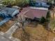 Aerial view of home featuring a red roof, an empty yard, and a driveway at 8715 Robilina Rd, Port Richey, FL 34668