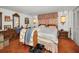 Spacious bedroom with vintage decor and a comfortable bed at 8715 Robilina Rd, Port Richey, FL 34668