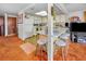 Eat-in kitchenette with a breakfast bar and stool seating with vintage tile floor at 8715 Robilina Rd, Port Richey, FL 34668