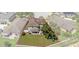 Back aerial view showcasing the backyard, including a covered patio, grassy area, and play set, inside property line at 8788 Fetterbush Ct, Brooksville, FL 34613