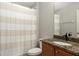 Bright bathroom features granite counters, and a shower-tub combination at 8788 Fetterbush Ct, Brooksville, FL 34613