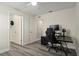 The bedroom features wood-look floors, multiple closets, and a ceiling fan at 8788 Fetterbush Ct, Brooksville, FL 34613