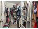 Walk-in closet featuring shelving and clothing racks for optimal storage at 8788 Fetterbush Ct, Brooksville, FL 34613