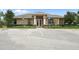 Exterior of a clubhouse with designated handicap parking spaces at 8788 Fetterbush Ct, Brooksville, FL 34613