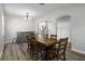 Dining room with a wood table, six chairs, and stylish wood flooring at 8788 Fetterbush Ct, Brooksville, FL 34613