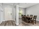 Dining room with neutral walls, wood-look floors, and a classic dining set at 8788 Fetterbush Ct, Brooksville, FL 34613