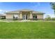 Well-maintained building exterior with a lush green lawn, enhancing curb appeal at 8788 Fetterbush Ct, Brooksville, FL 34613