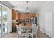 Eat-in kitchen features stainless steel appliances and a dining area at 8788 Fetterbush Ct, Brooksville, FL 34613