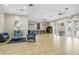 A spacious lounge with tile flooring, ample seating, and elegant decor, creating a welcoming atmosphere at 8788 Fetterbush Ct, Brooksville, FL 34613
