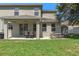 Covered patio offers outdoor dining space and access to large backyard at 8788 Fetterbush Ct, Brooksville, FL 34613