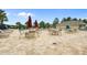 Community pool area features tables, chairs, umbrellas, and green landscaping at 8788 Fetterbush Ct, Brooksville, FL 34613