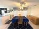 Lovely dining area featuring a large window for natural light and a modern ceiling fan at 9005 Prosperity Ln, Port Richey, FL 34668