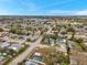 Expansive aerial view of a residential neighborhood, showcasing the community layout and proximity to nearby town at 9220 Saint Regis Ln, Port Richey, FL 34668
