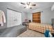 Cozy bedroom features tiled flooring, two beds, and a large closet; perfect for or guests at 9220 Saint Regis Ln, Port Richey, FL 34668