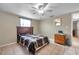 Bedroom with tile floor, ceiling fan, and minimal furniture at 9220 Saint Regis Ln, Port Richey, FL 34668