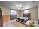 Bedroom with tile flooring, fan, and window at 9220 Saint Regis Ln, Port Richey, FL 34668