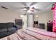 Bedroom with tile floors, a ceiling fan, and neutral wall color at 9220 Saint Regis Ln, Port Richey, FL 34668