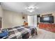 Bedroom with tile flooring, ceiling fan, and minimal decor at 9220 Saint Regis Ln, Port Richey, FL 34668