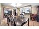 Elegant dining room with chandelier and view to the kitchen area at 9220 Saint Regis Ln, Port Richey, FL 34668