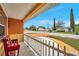 Inviting front porch with bench seating and street view at 9220 Saint Regis Ln, Port Richey, FL 34668