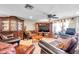 Cozy living room featuring tile floors, ample seating, and natural light at 9220 Saint Regis Ln, Port Richey, FL 34668