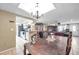 Bright living area showcasing an open floor plan connecting the dining area and modern kitchen at 9220 Saint Regis Ln, Port Richey, FL 34668