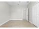 Bedroom with wood-look tile, closet, and neutral color palette at 11345 Thrasher Ave, Weeki Wachee, FL 34614