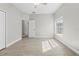 Bedroom features a ceiling fan and large window to let in natural light at 11345 Thrasher Ave, Weeki Wachee, FL 34614