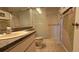 Functional bathroom featuring a vanity sink, toilet, and a walk-in shower with glass door at 12406 Eagleswood Dr # B, Hudson, FL 34667