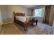 Bedroom with a window and wooden bed frame at 12406 Eagleswood Dr # B, Hudson, FL 34667
