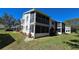Back exterior of this condo with screened in porch at 12406 Eagleswood Dr # B, Hudson, FL 34667