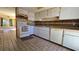 Kitchen featuring standard appliances and a view into the adjacent living space at 12406 Eagleswood Dr # B, Hudson, FL 34667