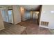 View of the living room showcasing the hardwood floors and a mirrored wall at 12406 Eagleswood Dr # B, Hudson, FL 34667