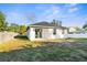 Backyard of a well-kept single story home with a covered patio at 12706 N Ola Ave, Tampa, FL 33612