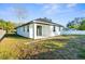 Backyard of a well-kept single story home with a covered patio at 12706 N Ola Ave, Tampa, FL 33612