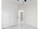 Bright bedroom features a closet and leads to an open doorway at 12706 N Ola Ave, Tampa, FL 33612