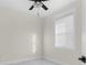 Bright bedroom features a ceiling fan and a window for natural light at 12706 N Ola Ave, Tampa, FL 33612