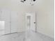 Bright bedroom features a closet and leads to an open doorway at 12706 N Ola Ave, Tampa, FL 33612