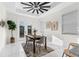 Bright dining room with modern furniture and a view of the backyard at 12706 N Ola Ave, Tampa, FL 33612
