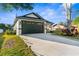 Beautiful home exterior with modern garage and landscaping at 12706 N Ola Ave, Tampa, FL 33612