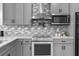 Well-appointed kitchen with stainless steel appliances and stylish backsplash at 12706 N Ola Ave, Tampa, FL 33612