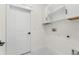 Clean laundry room with white cabinets and modern hookups at 12706 N Ola Ave, Tampa, FL 33612