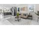 Bright living room with modern sofa, elegant rug, and an open concept layout at 12706 N Ola Ave, Tampa, FL 33612
